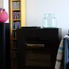 The music system in the living room comes with a CD player, a large selection of CDs, and a bluetooth connector so you can stream your own music from your phone